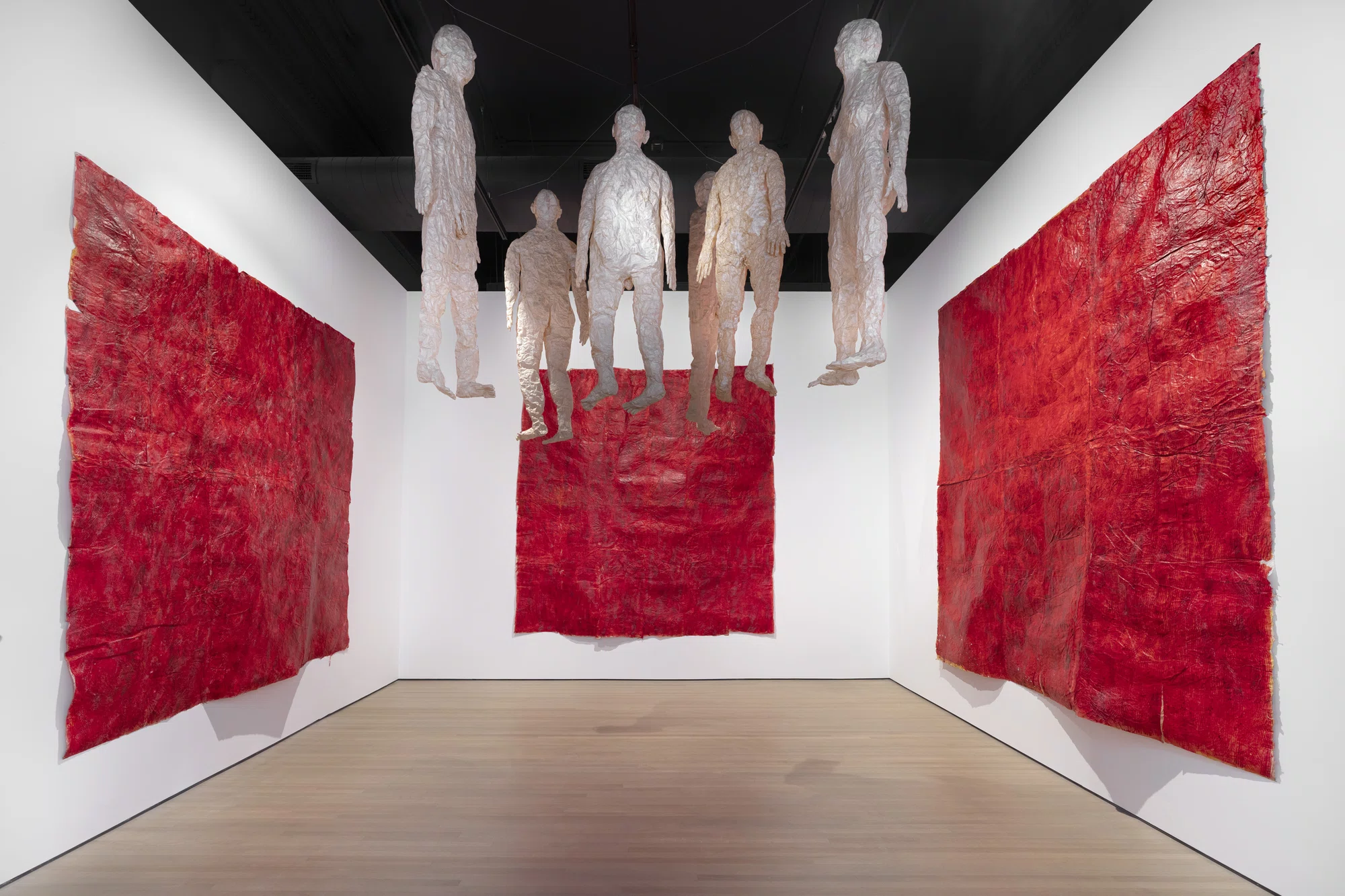 Untitled (paper figures red walls) by Kiki Smith
